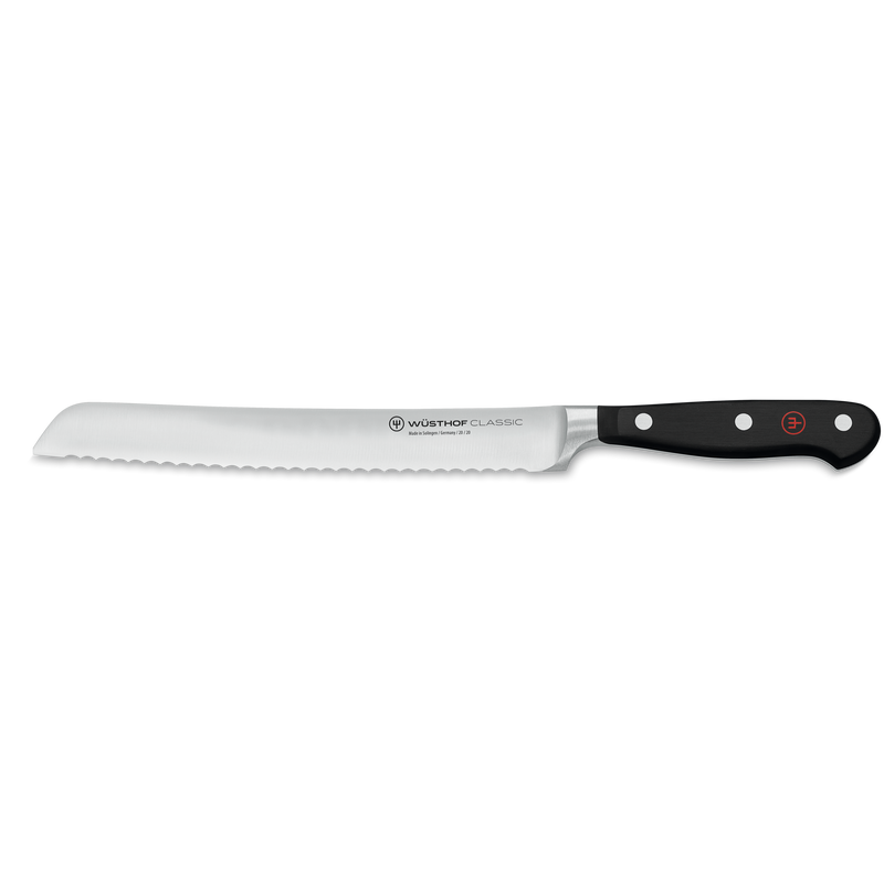 Classic 15-Piece Knife Block Set, Acacia featuring a serrated bread knife with a sharp forged stainless steel blade and black triple-riveted ergonomic handle by WÜSTHOF.