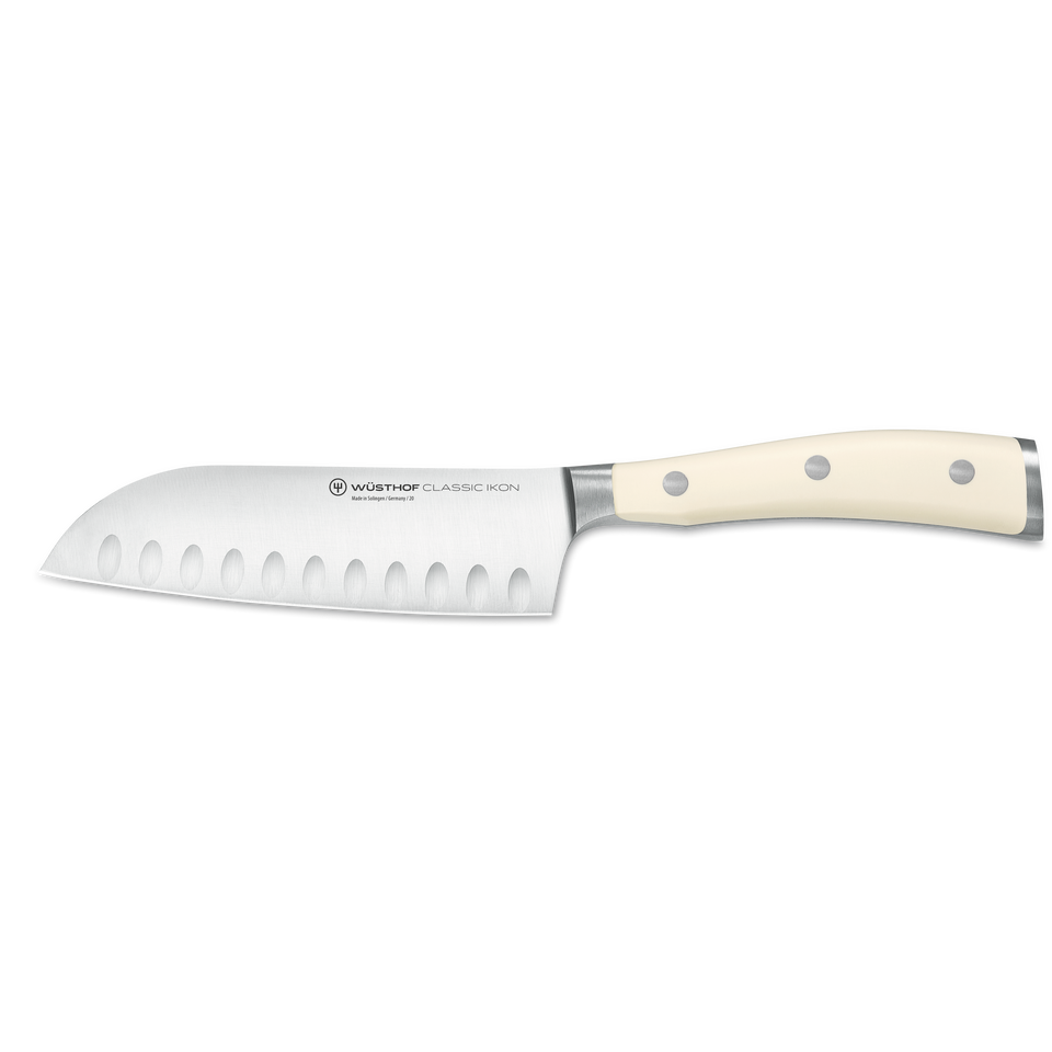 Classic Ikon 5" Hollow Edge Santoku with a forged German steel blade featuring hollowed indentations and a smooth triple-riveted ivory handle for precision cutting.