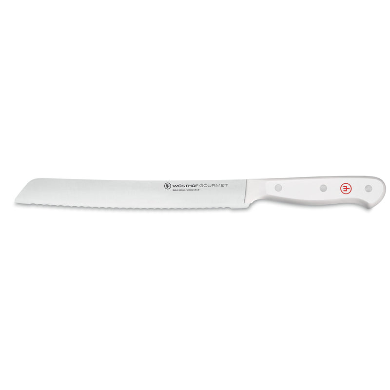 Gourmet White 18-Piece Knife Block Set featuring a serrated bread knife with a long forged German steel blade and ergonomic white handle with rivets and red emblem.