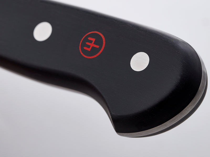Classic 36-Piece Knife Block Set close-up of a black ergonomic handle featuring the WÜSTHOF logo and polished rivets for durable, balanced grip.