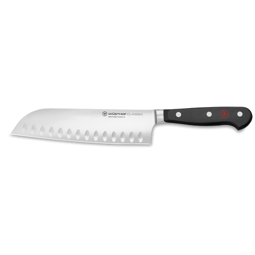 Classic 7" Hollow Edge Santoku with a forged German stainless steel blade featuring oval hollows and a triple-riveted black handle for expert kitchen use.