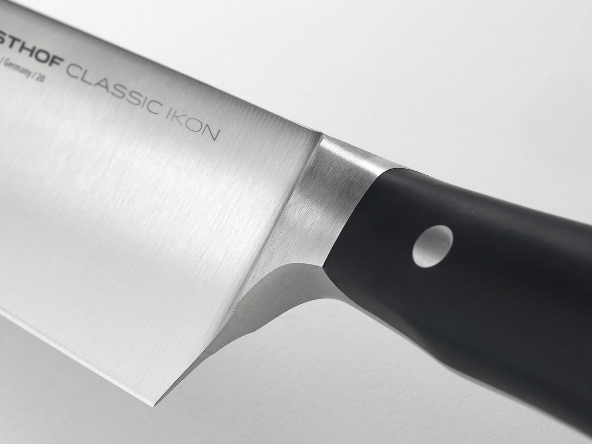 Classic Ikon 2-Piece Santoku Set close-up of a forged German knife blade with brushed finish and seamless black ergonomic handle for precision cutting.