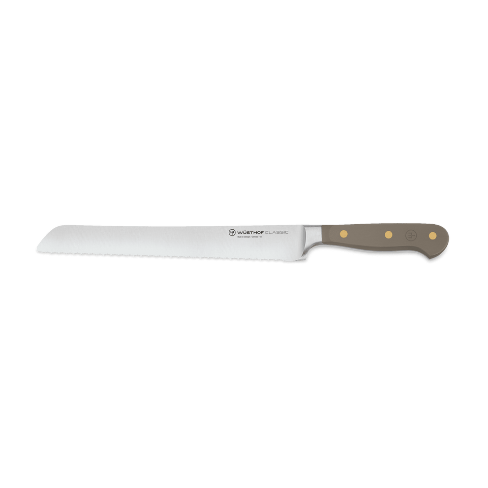 Classic 9" Precision Double-Serrated Bread Knife with a taupe ergonomic handle featuring brass rivets and a sharp forged stainless steel blade.