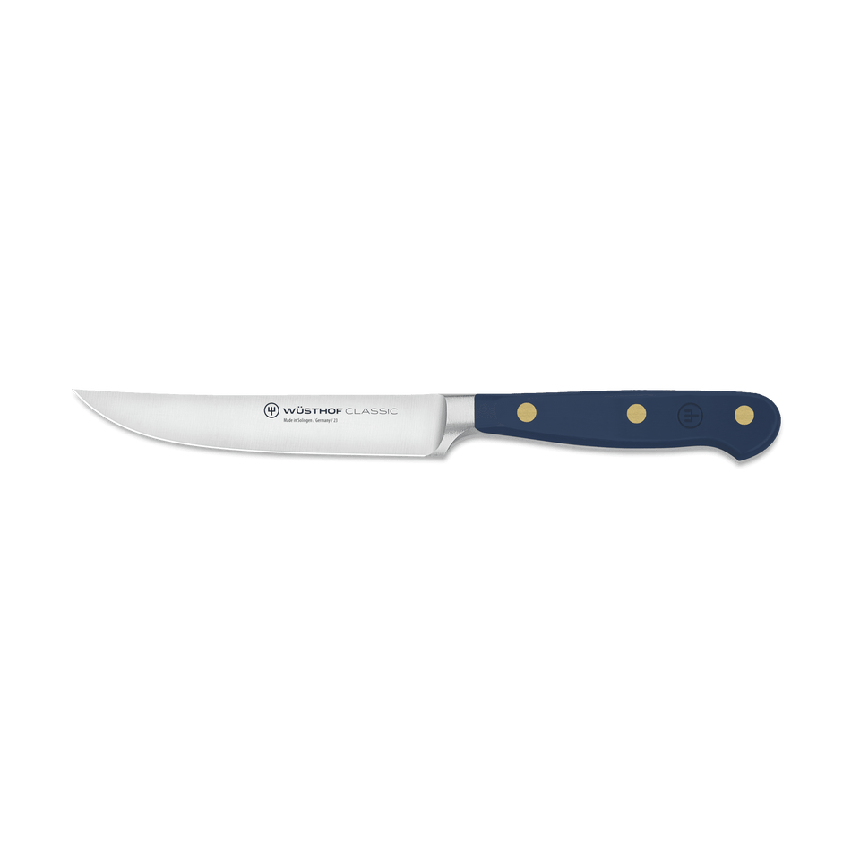 Classic 4 1/2" Steak Knife with a polished stainless steel blade and a dark blue ergonomic handle secured by three brass rivets for precise cutting and balance.
