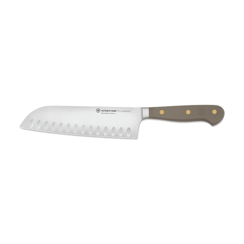 Classic 7" Hollow Edge Santoku with a German stainless steel blade featuring scalloped edges and a triple-riveted taupe handle for durability and control.
