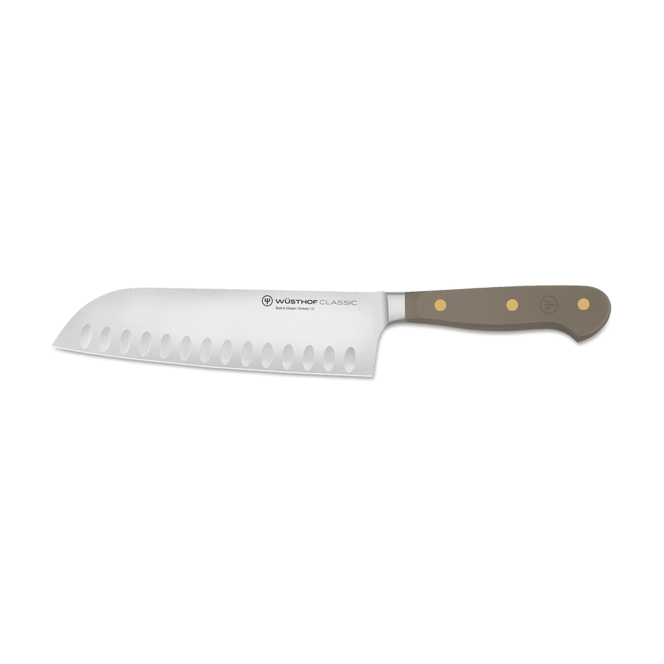 Classic 7" Hollow Edge Santoku with a German stainless steel blade featuring scalloped edges and a triple-riveted taupe handle for durability and control.