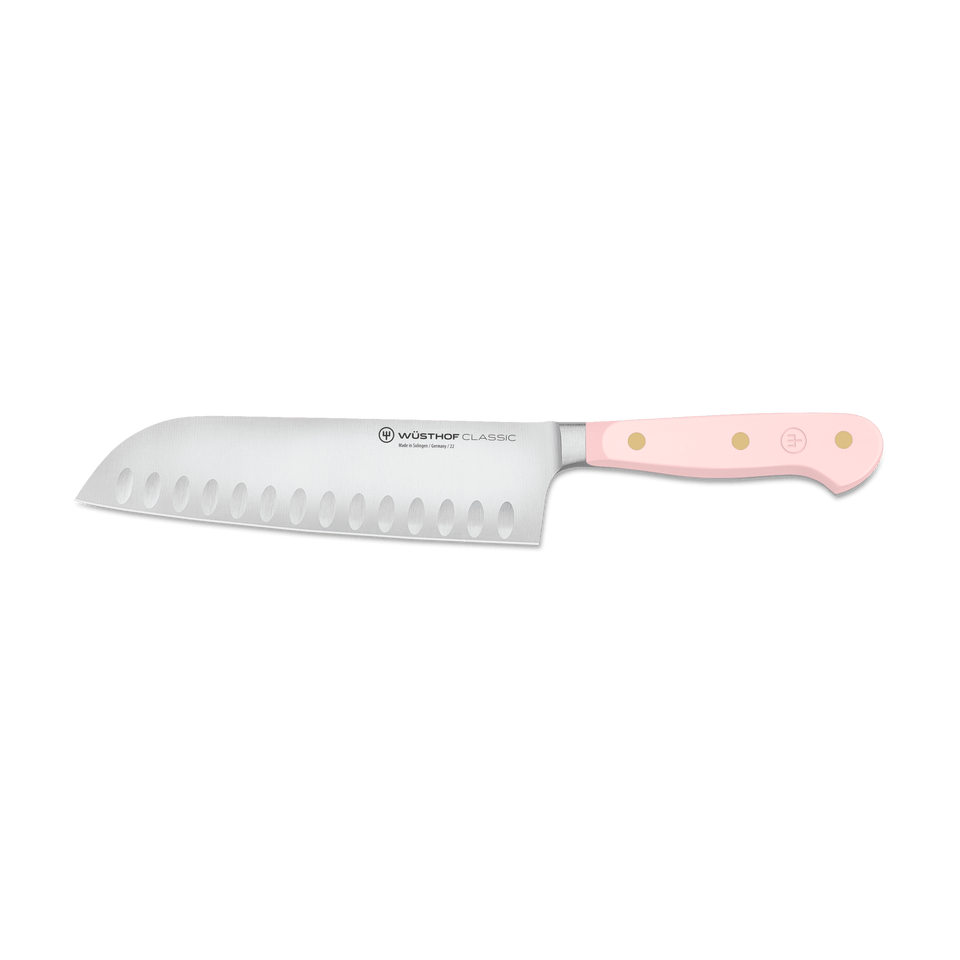 Classic 7" Hollow Edge Santoku with a smooth pastel pink triple-riveted handle and forged German steel blade designed for precise, effortless slicing.