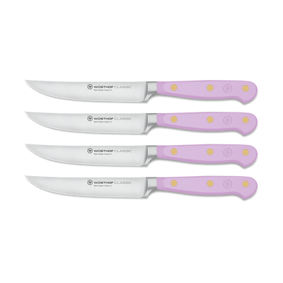 Classic 4-Piece Steak Knife Set featuring light purple ergonomic handles with three brass rivets and sharp forged German steel blades in varying sizes.