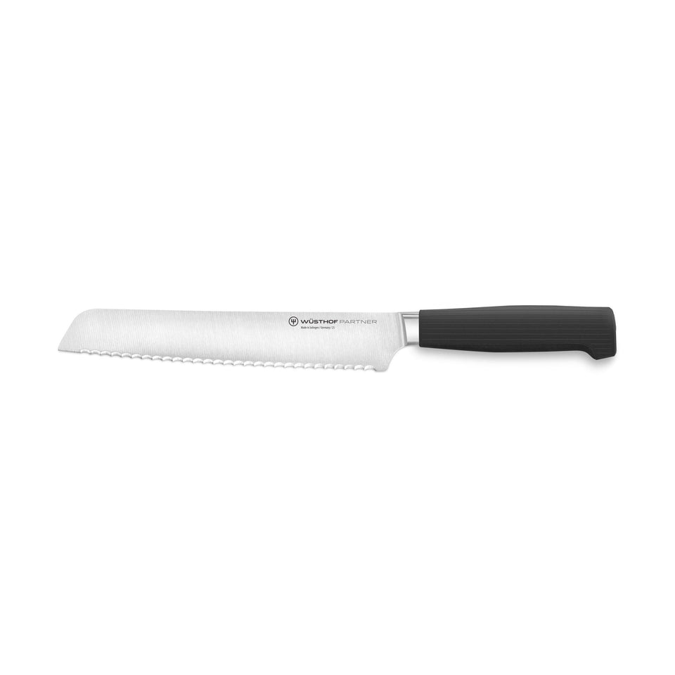 Partner 8” Bread Knife featuring a sharp serrated German-forged blade with a black ergonomic handle designed for effortless slicing of bread and baked goods.