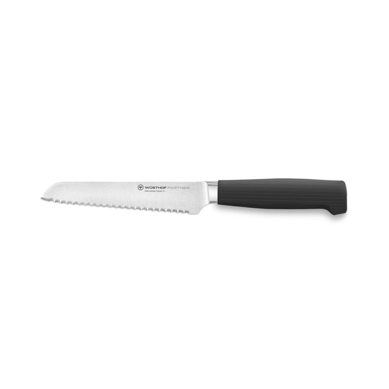 Partner 7-Piece Knife Block Set featuring a serrated bread knife with a sharp forged German blade and a comfortable black ergonomic handle for smooth slicing.