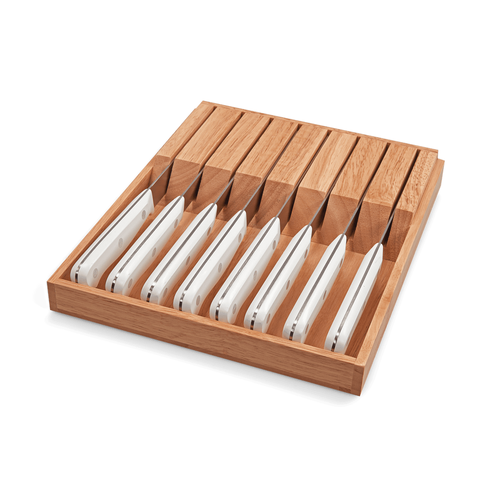 Gourmet 9-Piece In-Drawer Knife Tray Set featuring nine knives with white ergonomic handles neatly organized in a natural wood tray for efficient storage.