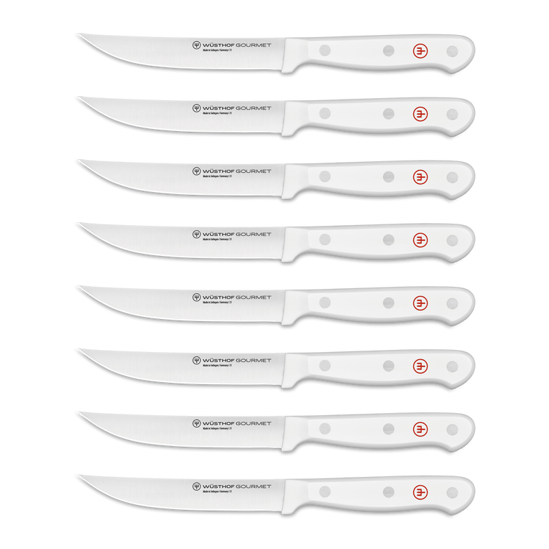 Gourmet 9-Piece In-Drawer Knife Tray Set showcasing seven assorted knives with white ergonomic handles and polished stainless steel forged blades for precise kitchen use.