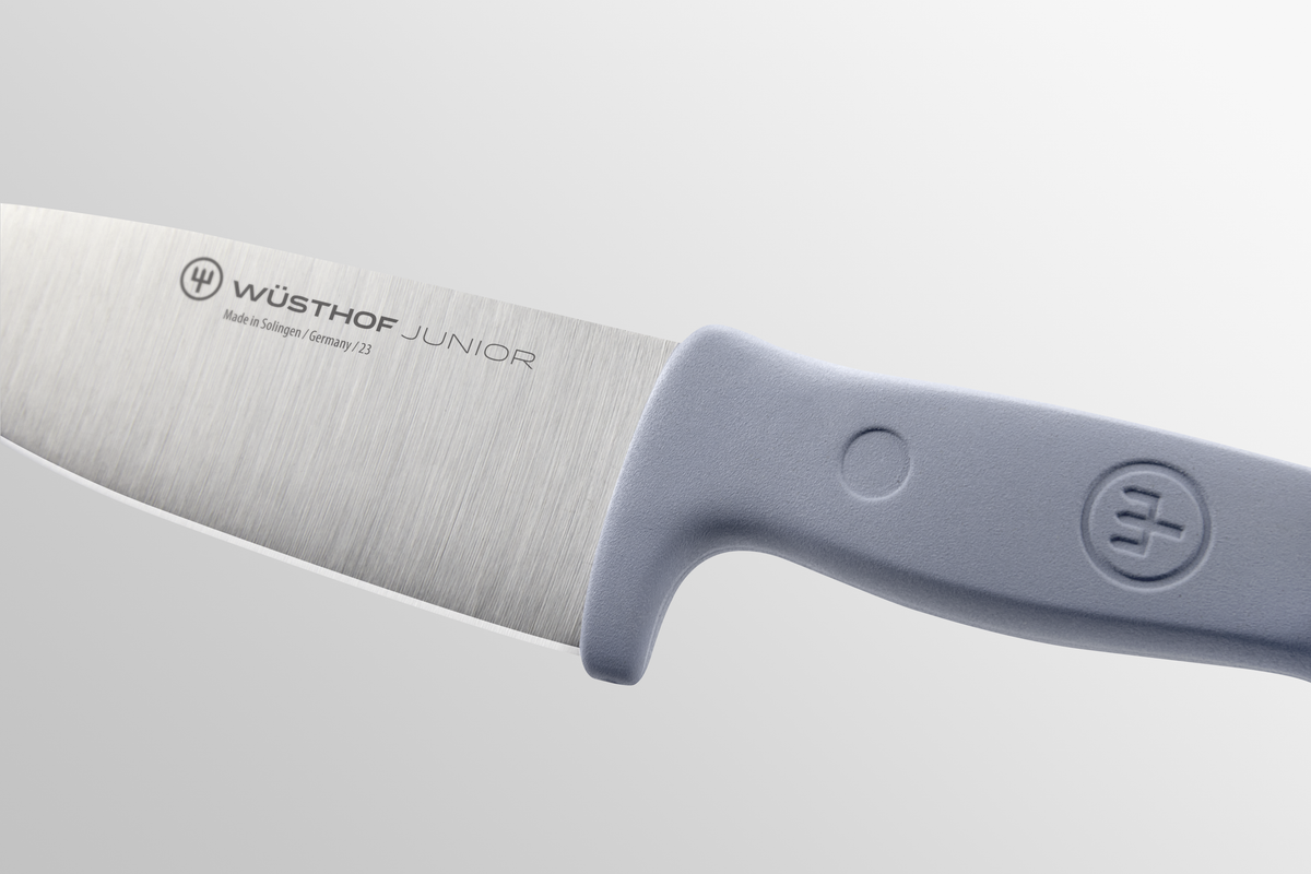 Junior 4" Chef’s Knife for Children featuring a forged German stainless steel blade and ergonomic soft gray handle designed for safe use by young cooks.