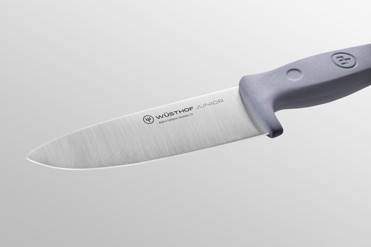 Junior 4" Chef’s Knife for Children featuring a forged German stainless steel blade and ergonomic gray handle designed for young cooks.