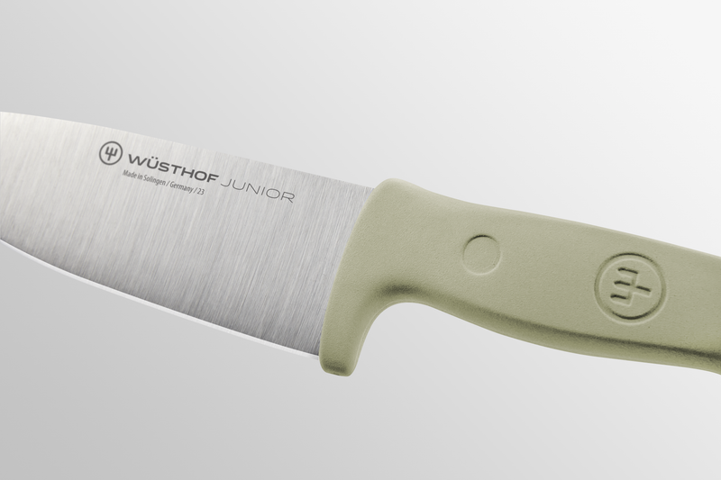 Junior 4" Chef’s Knife for Children with a sharp forged German stainless steel blade and ergonomic light green handle designed for young cooks.