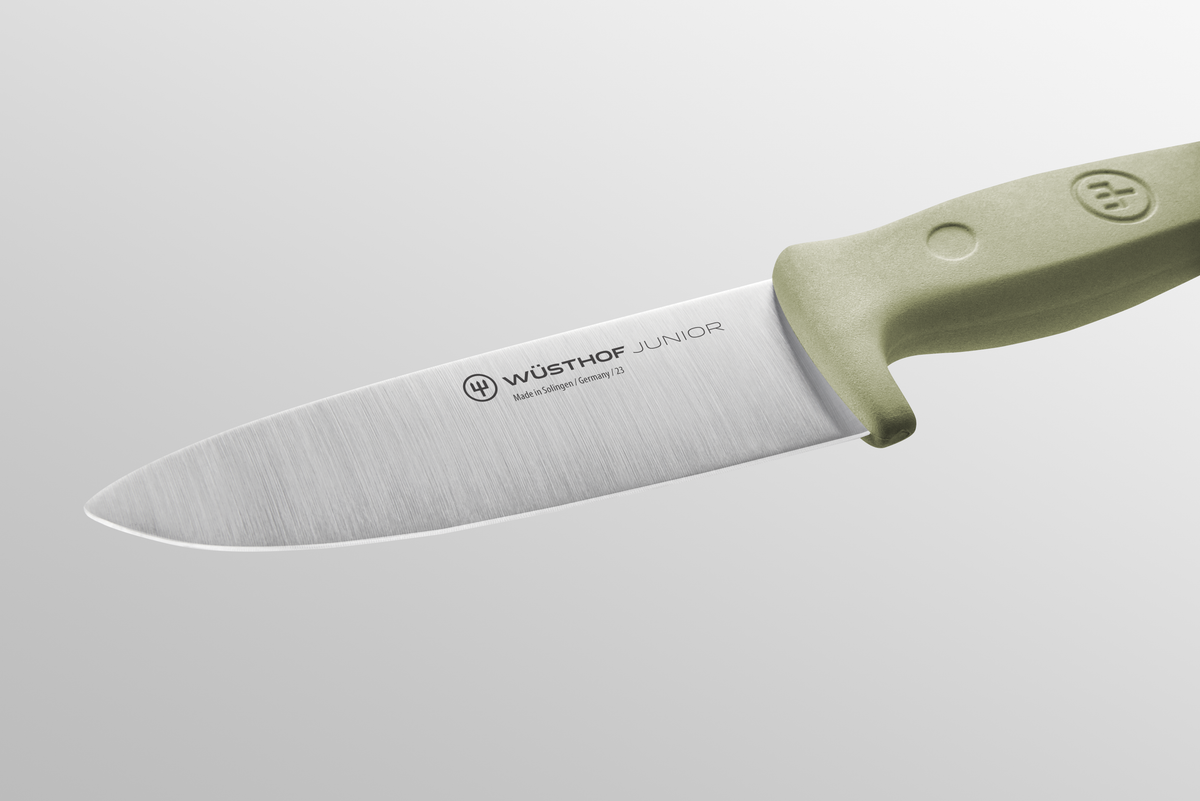 Junior 4" Chef’s Knife for Children with a forged German stainless steel blade and ergonomic light green handle designed for safe use by young cooks.