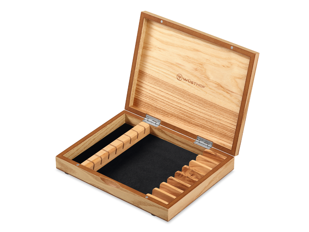 Natural wood storage box with WÜSTHOF logo and slots designed to hold the 8-Piece Stainless Mignon Steak Knife Set securely.