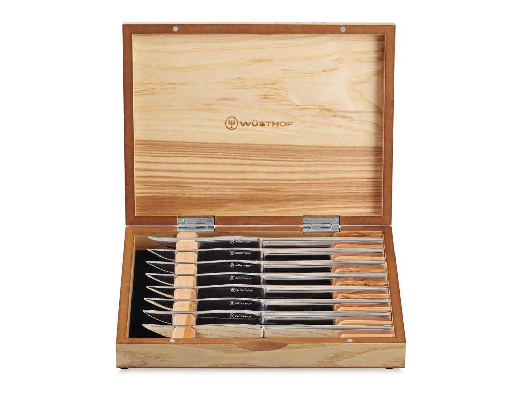 8-Piece Stainless Mignon Steak Knife Set with sharp stainless steel blades and polished handles, neatly arranged in a natural wood storage box.