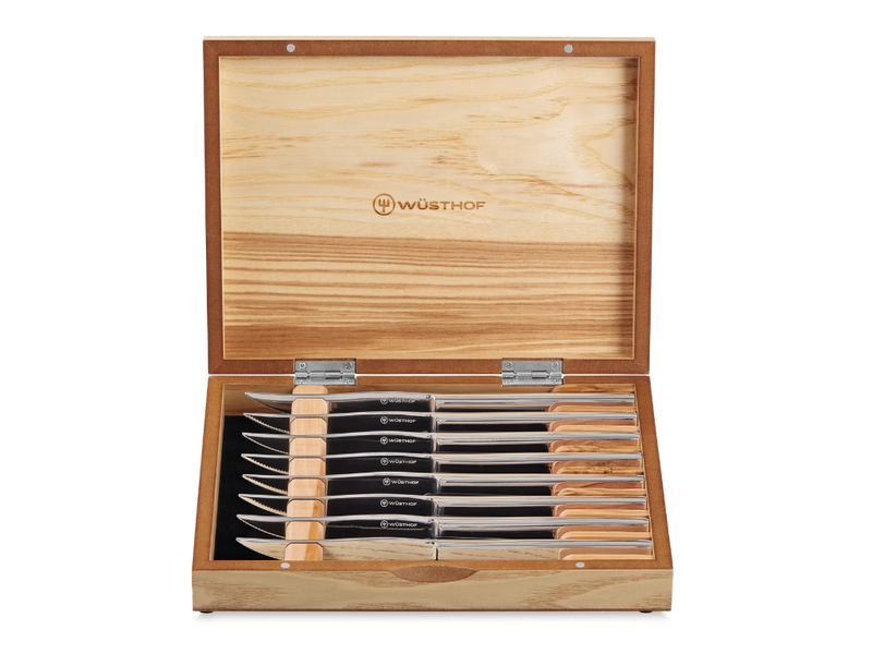 8-Piece Stainless Mignon Steak Knife Set with sharp stainless steel blades and polished handles, neatly arranged in a natural wood storage box.