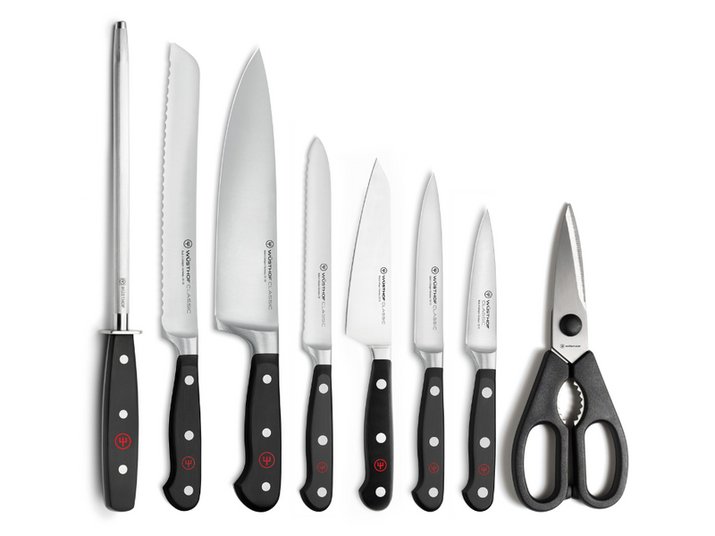 Classic 9-Piece Knife Block Set, Acacia featuring forged German kitchen knives with black ergonomic handles and sharp stainless steel blades alongside multipurpose kitchen shears.