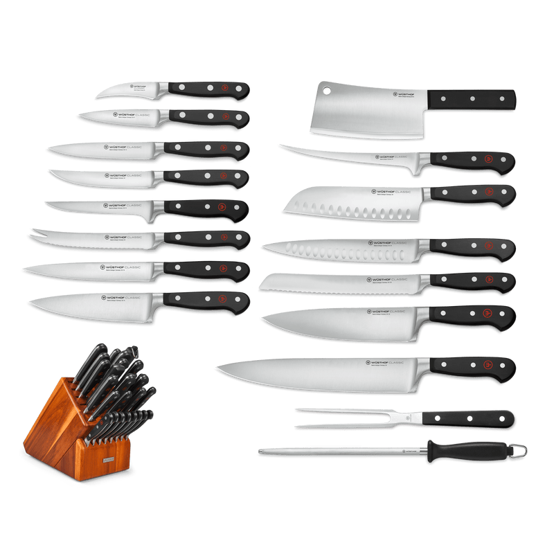 Classic 26-Piece Knife Block Set featuring forged German knives with black ergonomic handles, including chef’s knife, cleaver, serrated, paring knives, sharpening steel, kitchen shears, and wooden block.