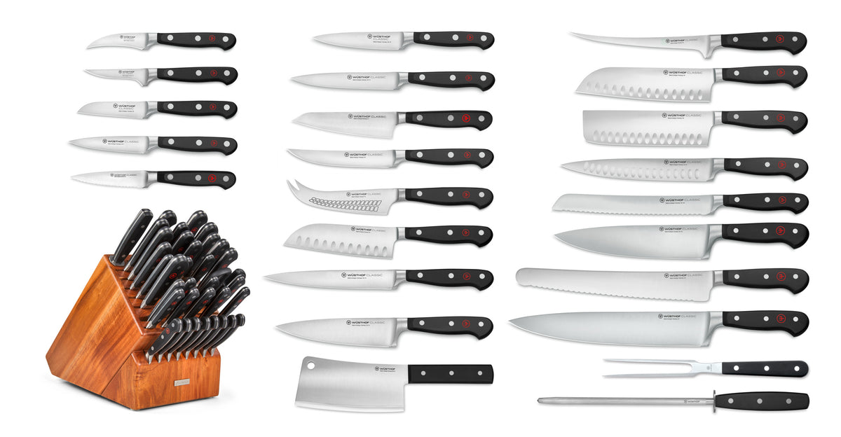 Classic 36-Piece Knife Block Set featuring forged German knives with black ergonomic handles, including a cleaver, carving fork, and a wooden storage block.