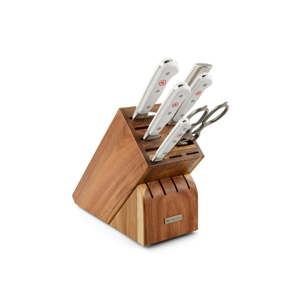 Classic 7-Piece Knife Block Set featuring forged German steel blades with white ergonomic handles and a wooden block with a natural finish.