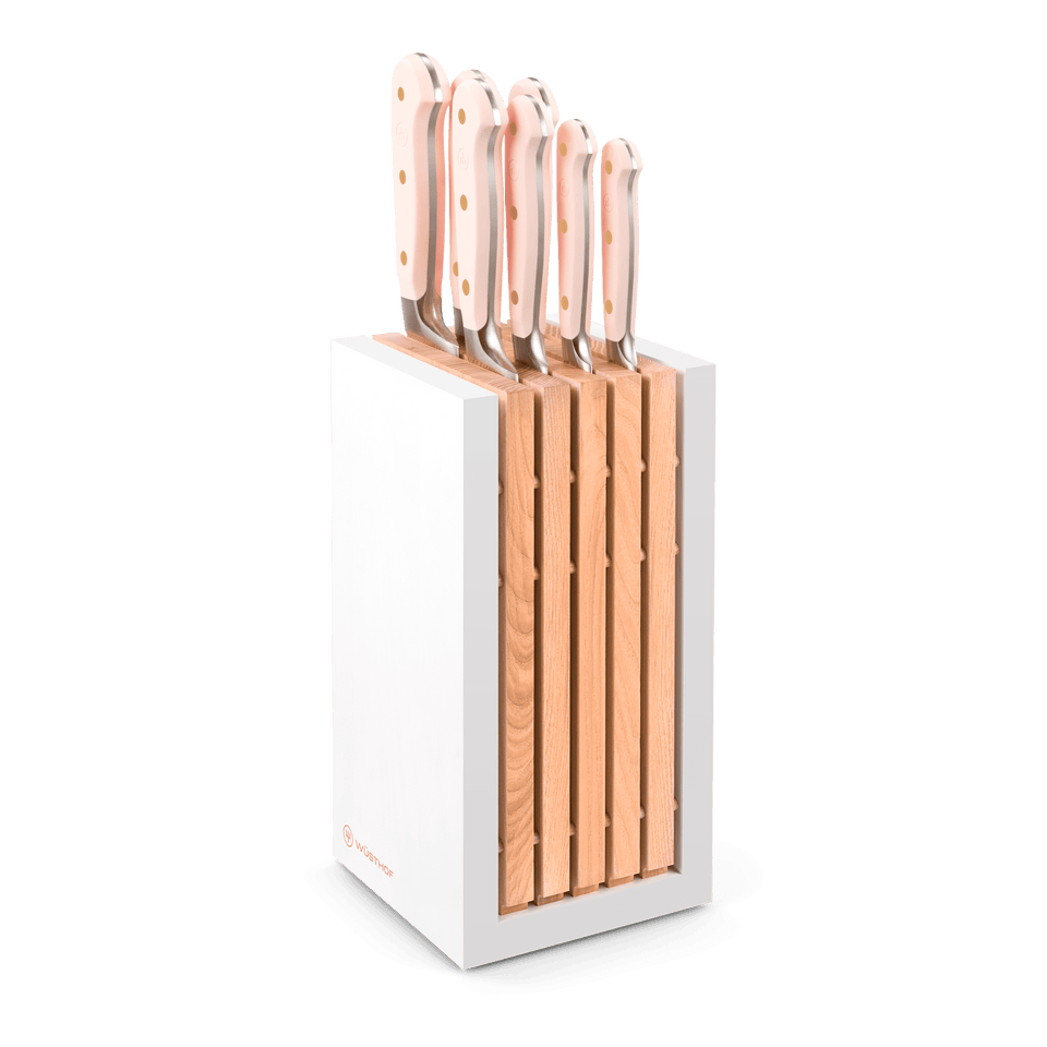 Classic 8-Piece Designer Knife Block Set with forged German steel blades and ergonomic light pink handles, housed in a modern white and wood block.