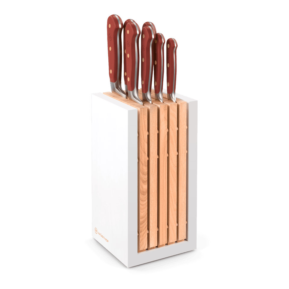 Classic 8-Piece Designer Knife Block Set with forged German steel blades and ergonomic red handles, housed in a sleek white and wood block.