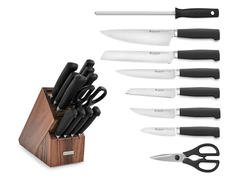 Partner 12-Piece Knife Block Set featuring forged German blades with black ergonomic handles, kitchen shears, sharpening steel, and a walnut wood block for organized kitchen storage.