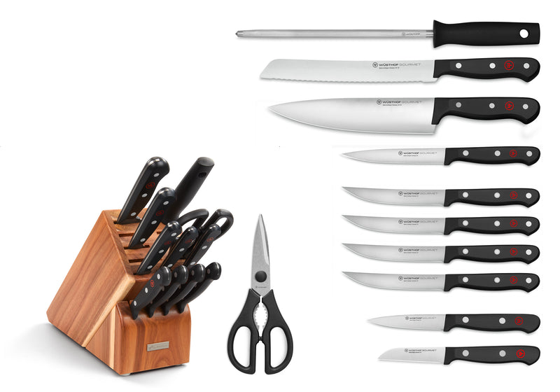 Gourmet 12-Piece Knife Block Set featuring forged German knives with black ergonomic handles including a chef’s knife, bread knife, honing steel, kitchen shears, and a wooden storage block.