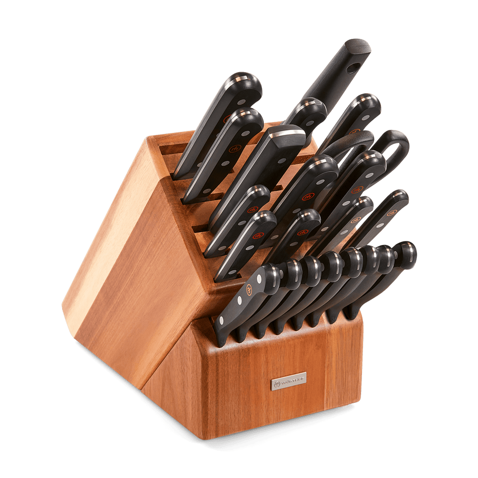Gourmet 23-Piece Knife Block Set featuring forged German knives with black ergonomic handles neatly stored in a polished wooden block for organized kitchen use.