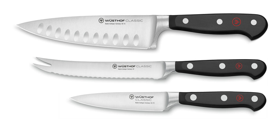 Classic 3-Piece Ultimate Chef's Knife Set featuring forged German knives with black ergonomic handles, including chef, serrated utility, and paring blades.