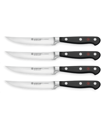 Classic 4-Piece Steak Knife Set featuring forged German steel blades with triple-riveted black handles for precise cutting and balanced grip.
