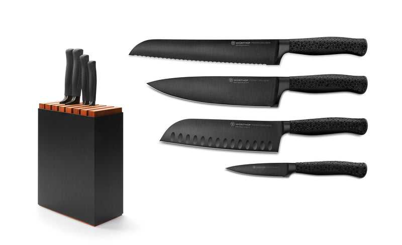 Performer 5-Piece Knife Block Set with black textured handles and forged German steel blades including bread, chef, santoku, and paring knives in a black wooden block.