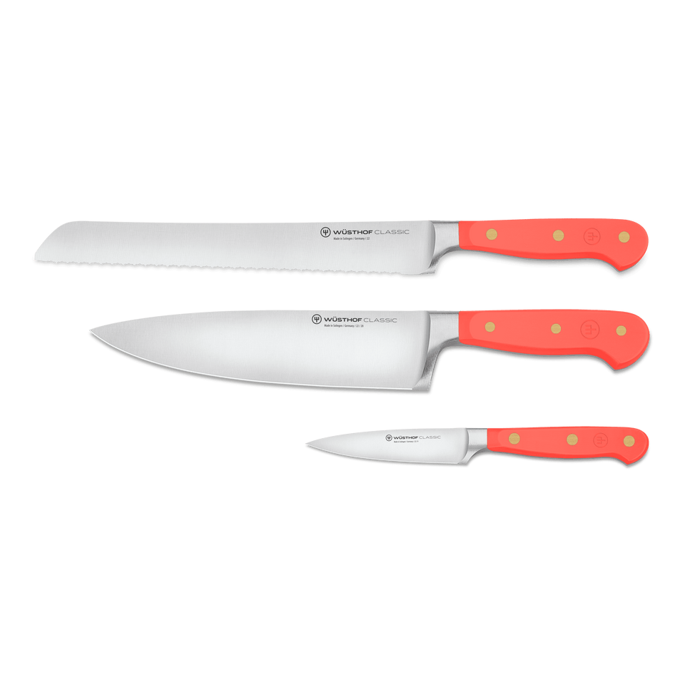 Classic 3-Piece Essential Knife Set - Coral Peach featuring forged German kitchen knives with sharp stainless steel blades and vibrant coral peach ergonomic handles with brass rivets.