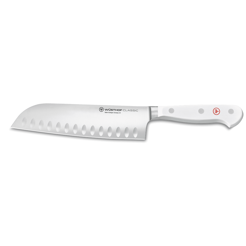 Classic 7" Hollow Edge Santoku featuring a forged German blade with oval indentations and a triple-riveted white handle for expert kitchen cutting.