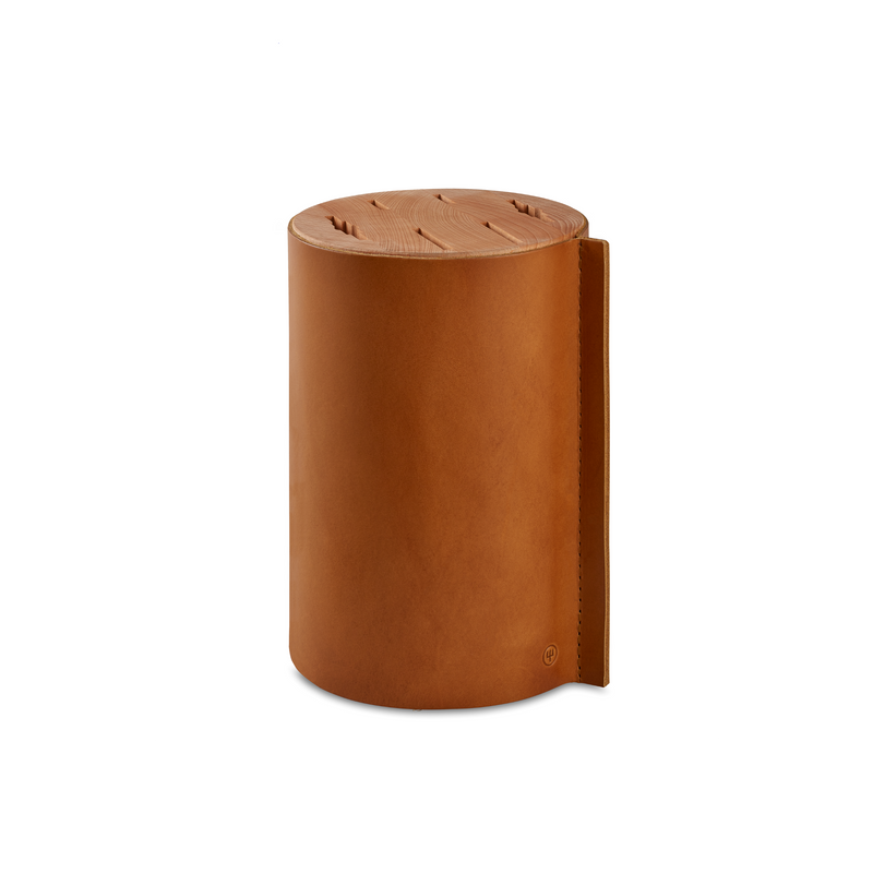 Villa 6-Piece Knife Block Set featuring a cylindrical leather knife block with a wooden top insert designed to securely store multiple knives.
