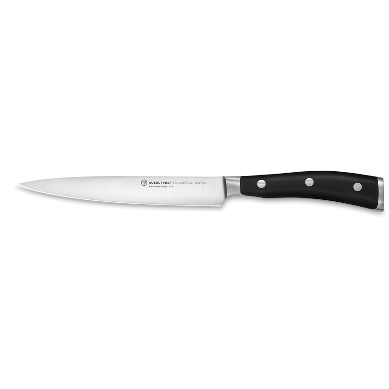 WÜSTHOF Classic Ikon 7-Piece Knife Block Set featuring a slender, forged German steel paring knife with a polished blade and triple-riveted black ergonomic handle.