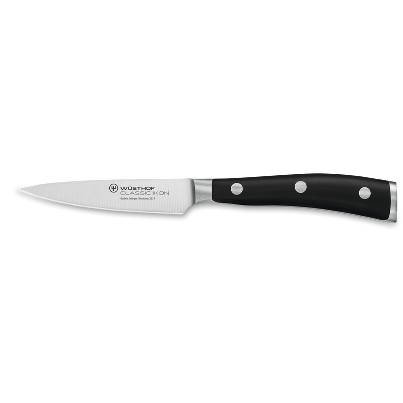 Paring knife from the Classic Ikon 7-Piece Knife Block Set with forged German steel blade and ergonomic triple-riveted black handle.