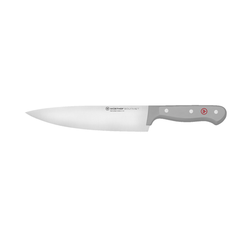 Gourmet 7-Piece Block Set featuring a forged German chef’s knife with a sharp, tapered blade and ergonomic gray handle accented by polished rivets and a red logo.
