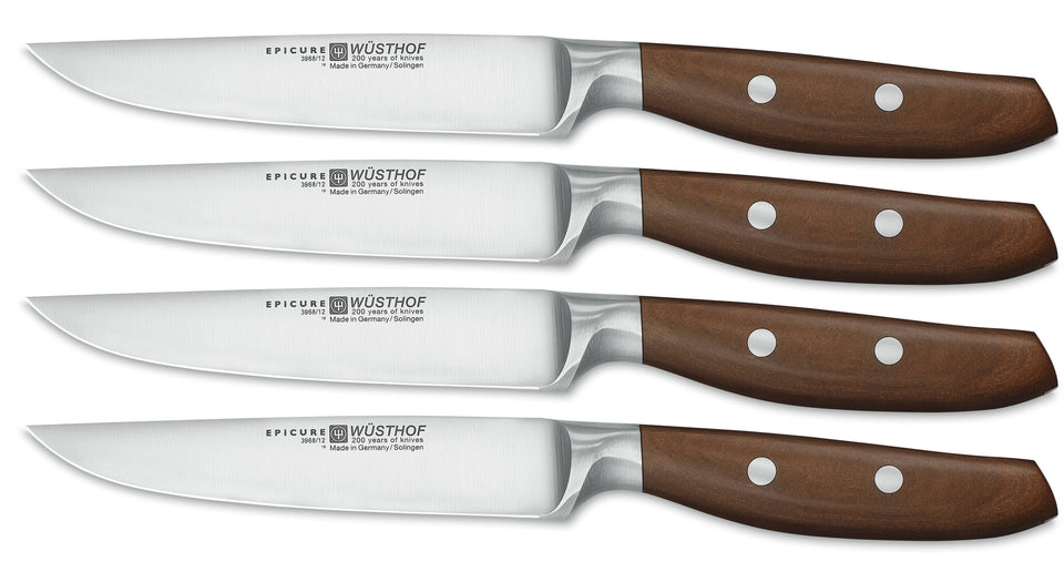Epicure 4-Piece Steak Knife Set featuring sharp forged German blades with polished brown wooden handles secured by steel rivets for balanced cutting.