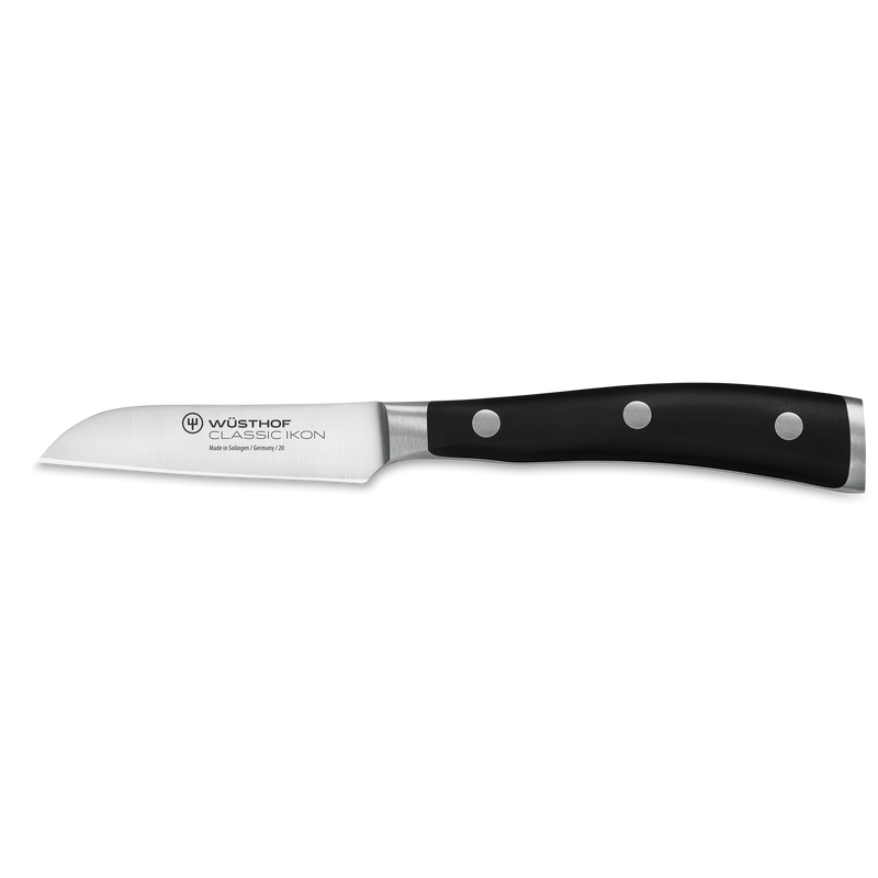Classic Ikon 11-Piece Knife Block Set featuring a forged German paring knife with a serrated stainless steel blade and triple-riveted black ergonomic handle.