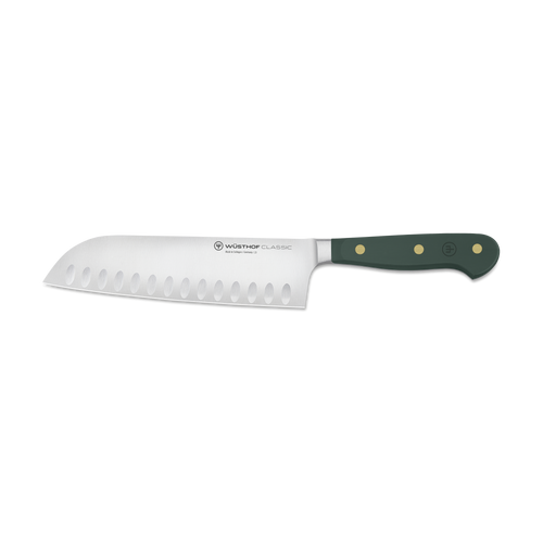 Serrated knife with a green handle on a white background