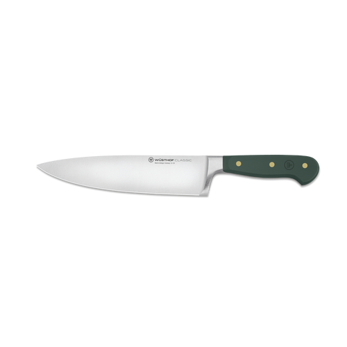 Chef's knife with a green handle on a white background