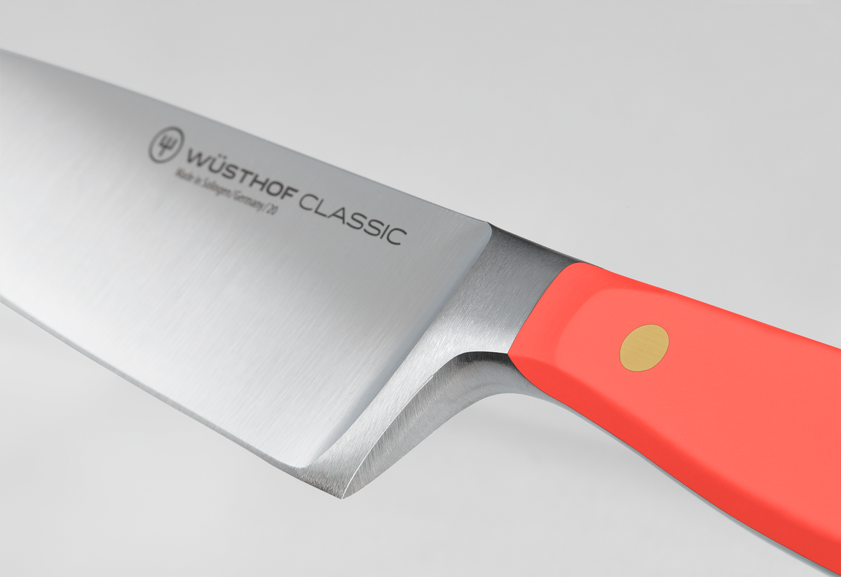 Classic 2-Piece Knife Set - Coral Peach showing a forged German stainless steel chef’s knife with a coral peach ergonomic handle and brass rivet detail.