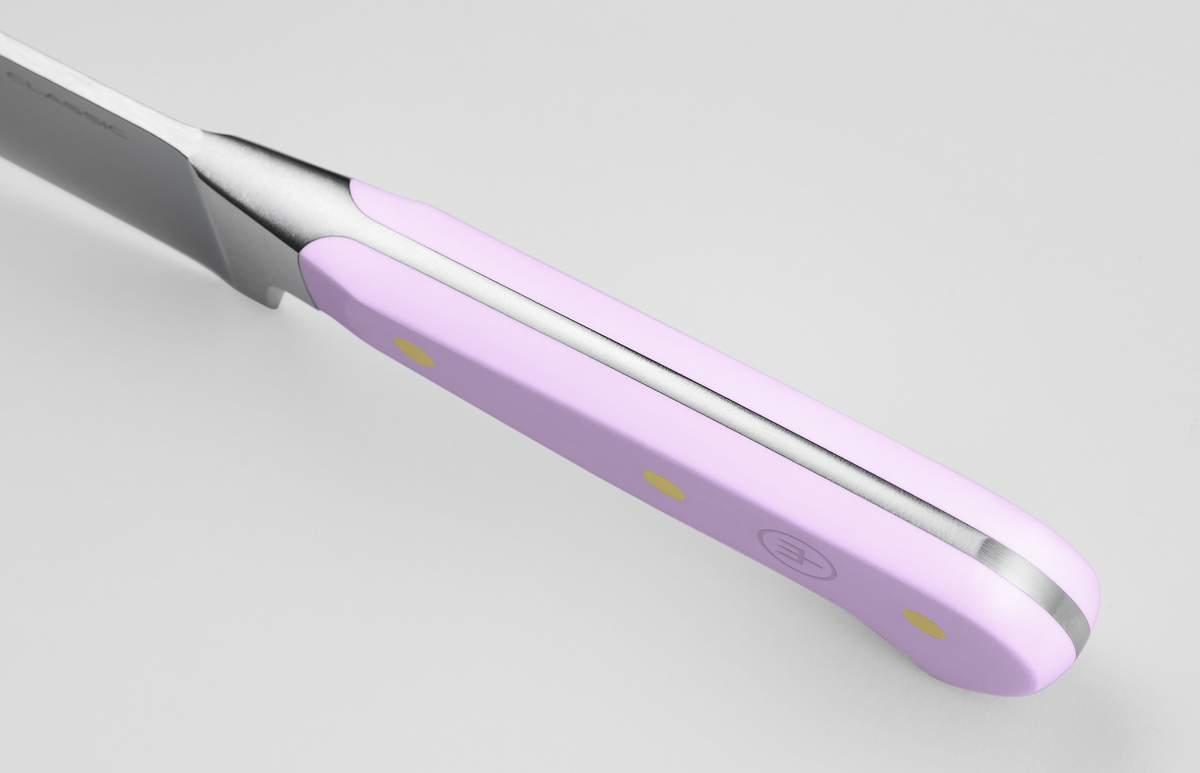 Classic 4-Piece Steak Knife Set featuring a close-up of a light purple triple-riveted handle with full tang forged German steel construction and a subtle embossed logo.