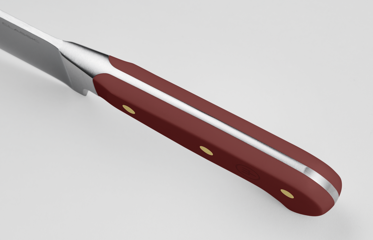 Classic 8" Chef's Knife featuring a forged German steel blade with a full tang and a deep red handle secured by three brass rivets for enhanced control.