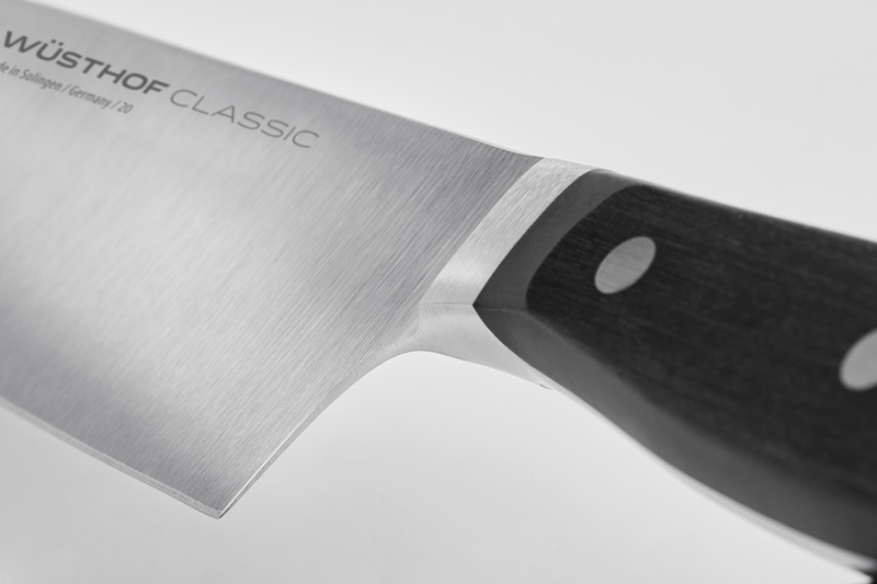 Classic 4 1/2" Asian Utility Knife close-up showing the polished forged German steel blade and triple-riveted dark ergonomic handle.