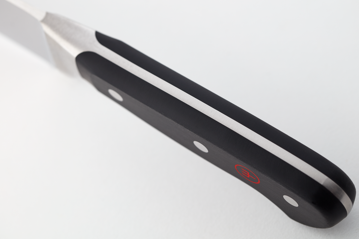 Classic 4 1/2" Asian Utility Knife showing the triple-riveted black handle with ergonomic design and a full tang for balanced, durable use.